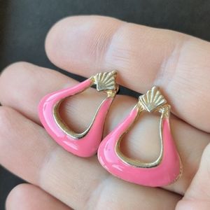Vintage gold tone stud earrings with pink enamel